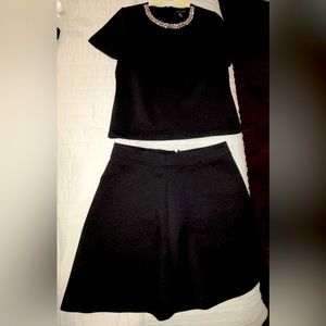 Black shirt and skirt set with bejeweled collar